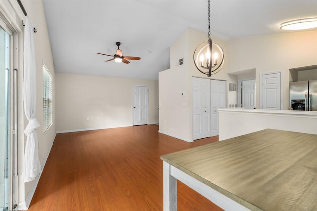 10000 SW 52nd Ave Unit J50, Gainesville, FL 32608 - unfurnished dining area with high vaulted ceiling, a chandelier, ceiling fan, baseboards, and wood finished floors