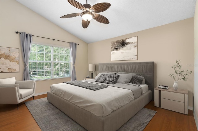 10000 SW 52nd Ave Unit J50, Gainesville, FL 32608 - bedroom with lofted ceiling, wood finished floors, ceiling fan, and baseboards