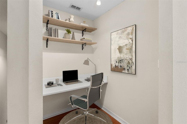 10000 SW 52nd Ave Unit J50, Gainesville, FL 32608 - office space with built in desk, dark wood-type flooring, and baseboards