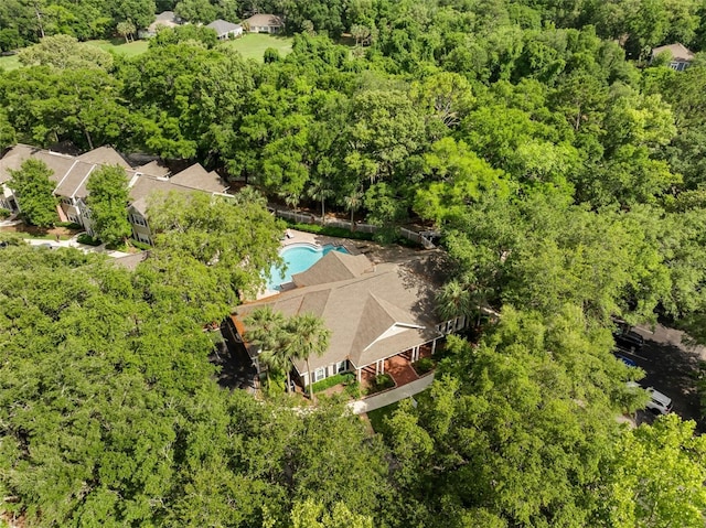 10000 SW 52nd Ave Unit J50, Gainesville, FL 32608 - aerial view of a pool area and a heavily wooded area