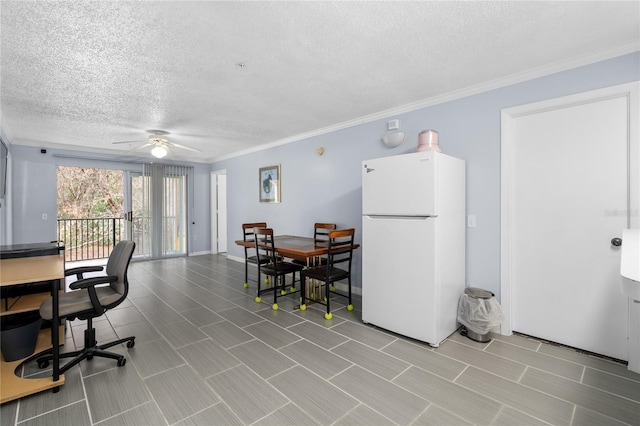 office space featuring a textured ceiling, a ceiling fan, and ornamental molding