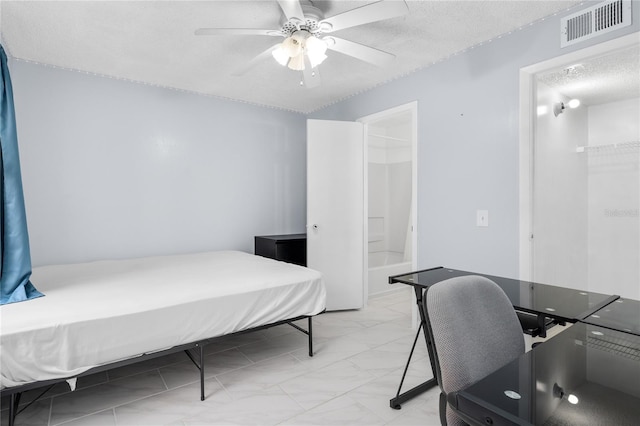 bedroom featuring light marble finish flooring, a textured ceiling, a ceiling fan, and ensuite bathroom