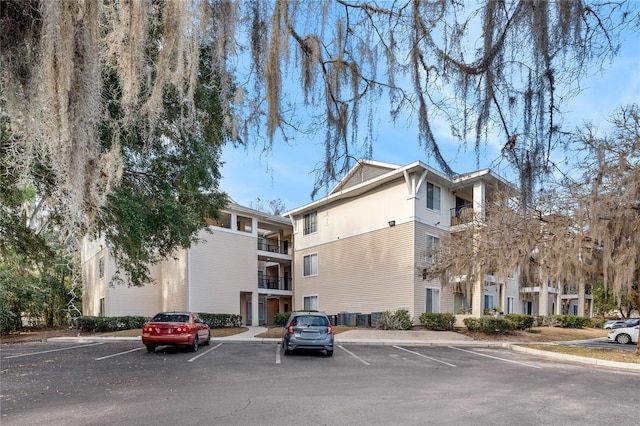 view of property featuring uncovered parking