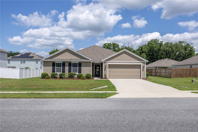 ranch-style home featuring concrete driveway and an attached garage