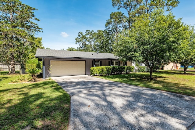 5610 NW 29th Ter, Gainesville, FL 32653 - single story home with an attached garage, concrete driveway, and a front lawn
