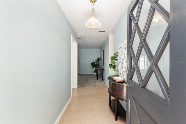 5610 NW 29th Ter, Gainesville, FL 32653 - hall with light tile patterned flooring and light colored carpet