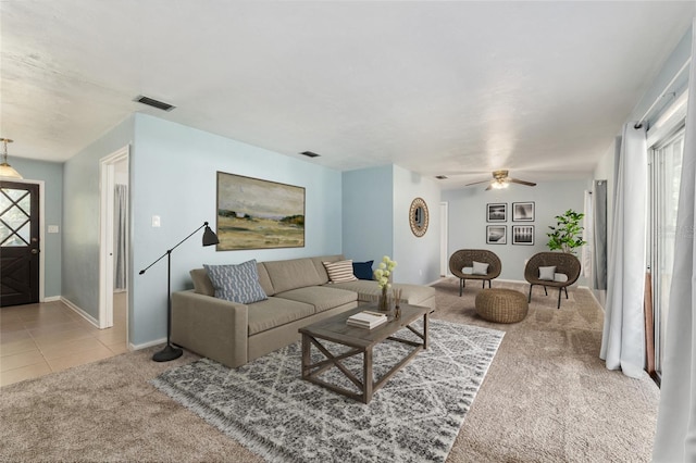5610 NW 29th Ter, Gainesville, FL 32653 - carpeted living room with a ceiling fan and tile patterned flooring