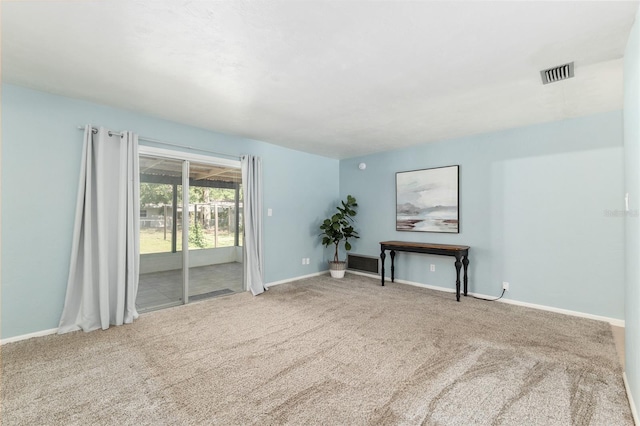 5610 NW 29th Ter, Gainesville, FL 32653 - spare room featuring carpet and baseboards