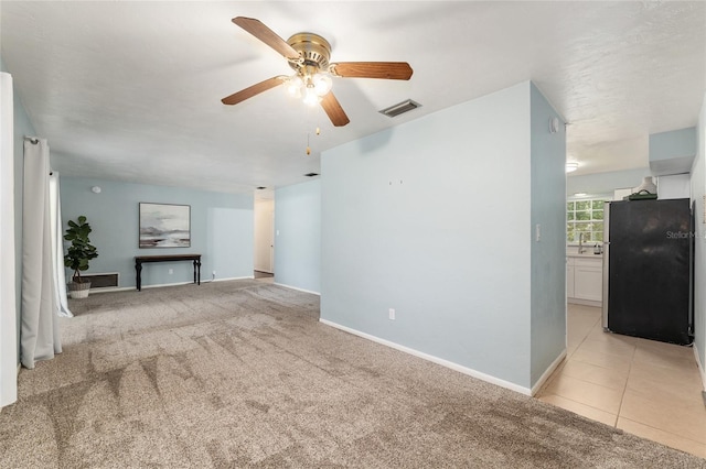 5610 NW 29th Ter, Gainesville, FL 32653 - unfurnished living room featuring ceiling fan and light carpet