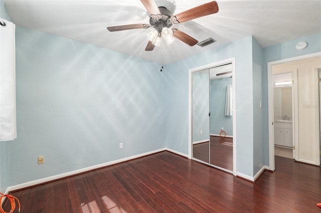 5610 NW 29th Ter, Gainesville, FL 32653 - unfurnished bedroom with wood finished floors, a closet, and a ceiling fan