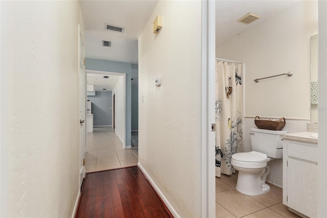 5610 NW 29th Ter, Gainesville, FL 32653 - full bath featuring vanity, tile patterned floors, and a shower with shower curtain