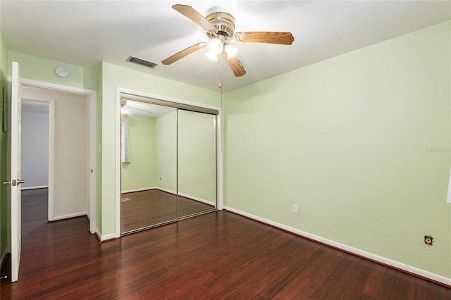 5610 NW 29th Ter, Gainesville, FL 32653 - unfurnished bedroom with wood finished floors, a closet, and a ceiling fan