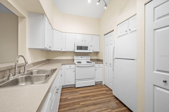 9119 SW 52nd Ave Unit C301, Gainesville, FL 32608 - kitchen with white appliances, a sink, white cabinetry, dark wood-style floors, and light countertops