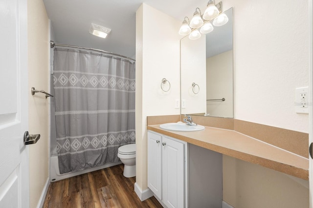 9119 SW 52nd Ave Unit C301, Gainesville, FL 32608 - full bath with toilet, wood finished floors, vanity, and shower / bathtub combination with curtain