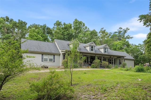 14204 SW 70th St, Archer, FL 32618 - cape cod home with a front lawn and covered porch