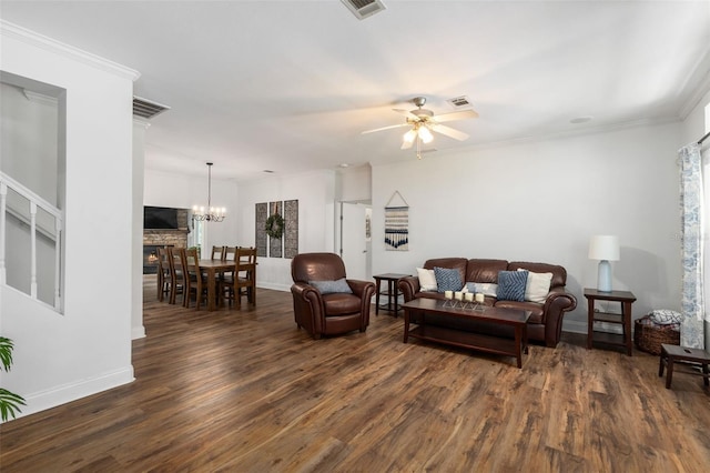 14204 SW 70th St, Archer, FL 32618 - living room with dark wood-type flooring, a ceiling fan, baseboards, ornamental molding, and a chandelier