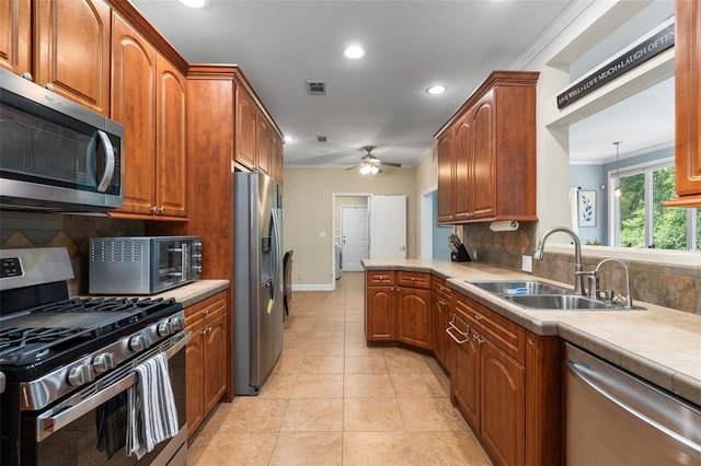 14204 SW 70th St, Archer, FL 32618 - kitchen featuring stainless steel appliances, ceiling fan, decorative backsplash, recessed lighting, and light tile patterned flooring