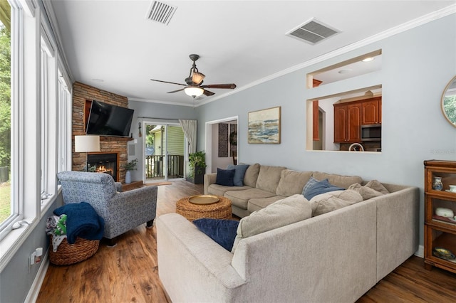 14204 SW 70th St, Archer, FL 32618 - living area with a ceiling fan, wood finished floors, a fireplace, and ornamental molding