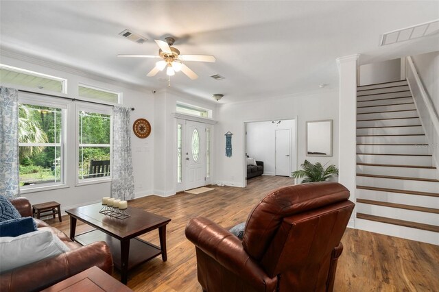 14204 SW 70th St, Archer, FL 32618 - living room featuring stairway, ceiling fan, wood finished floors, and baseboards
