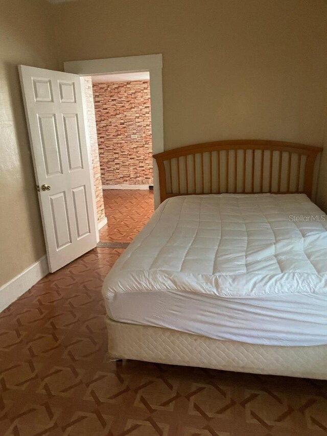 31 NW 4th St, Williston, FL 32696 - bedroom featuring baseboards
