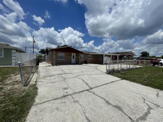 6019 W Fern St, Tampa, FL 33634 - view of front of house featuring asphalt driveway and fence