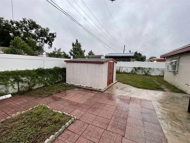6019 W Fern St, Tampa, FL 33634 - view of patio featuring a shed and an outbuilding