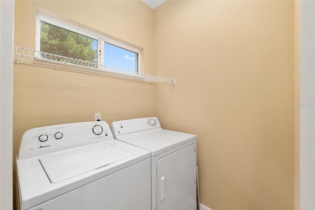 3664 NW 55th Ln, Gainesville, FL 32653 - laundry room with washer and clothes dryer and baseboards