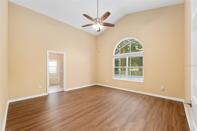 3664 NW 55th Ln, Gainesville, FL 32653 - unfurnished room featuring wood finished floors, ceiling fan, baseboards, and high vaulted ceiling