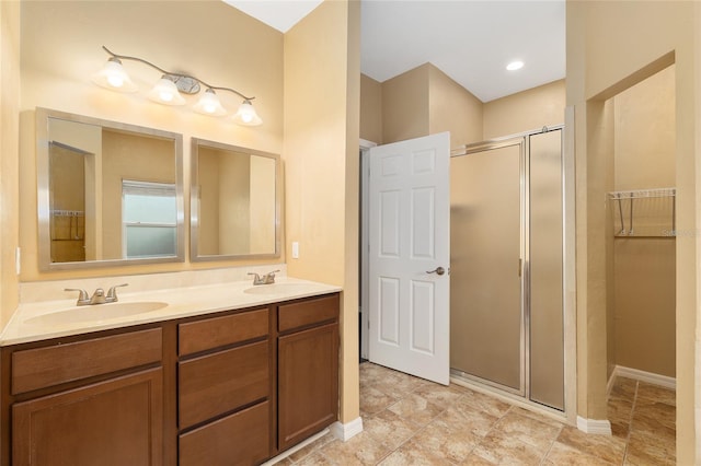 3664 NW 55th Ln, Gainesville, FL 32653 - full bath with a stall shower, double vanity, and baseboards
