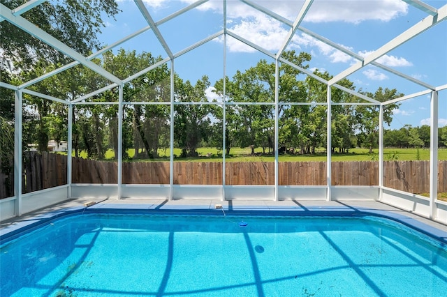 3664 NW 55th Ln, Gainesville, FL 32653 - view of pool with view of wooded area and a lanai