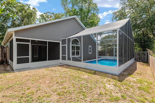3664 NW 55th Ln, Gainesville, FL 32653 - rear view of house with a sunroom and glass enclosure