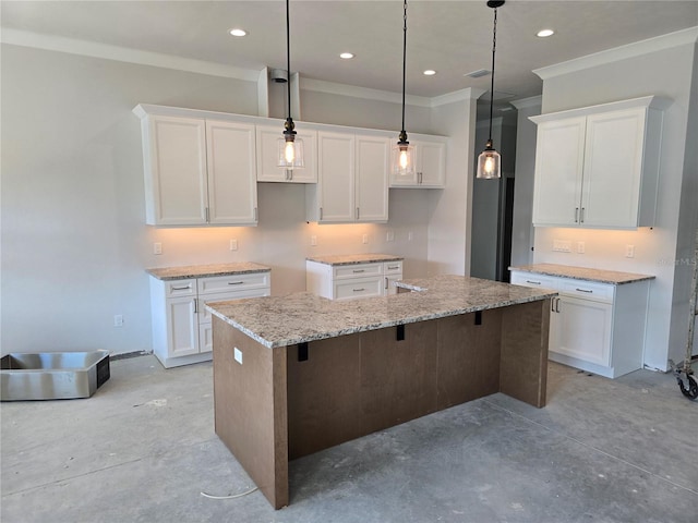 kitchen featuring unfinished concrete floors, a kitchen island with sink, white cabinets, crown molding, and recessed lighting