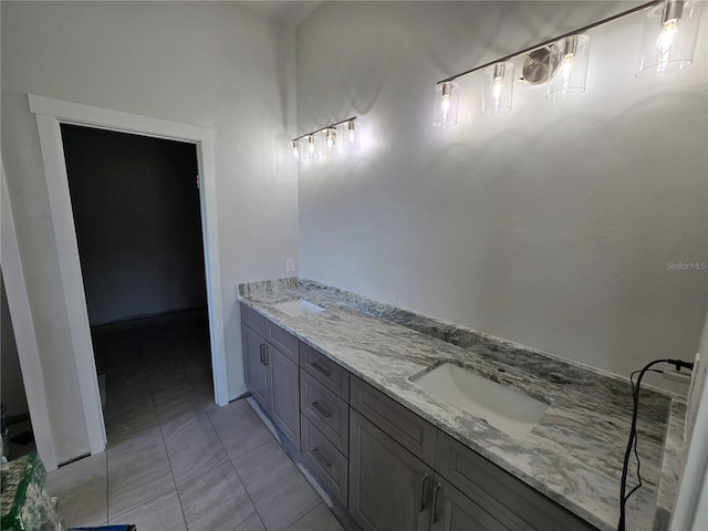 bathroom featuring tile patterned floors and double vanity