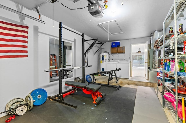 workout area with washing machine and clothes dryer, attic access, and water heater