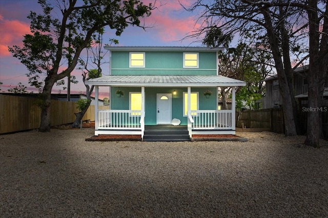 203 1st Ave SE, Steinhatchee, FL 32359 - view of front facade featuring a porch and metal roof