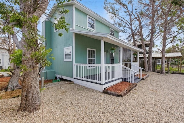203 1st Ave SE, Steinhatchee, FL 32359 - view of front facade with covered porch