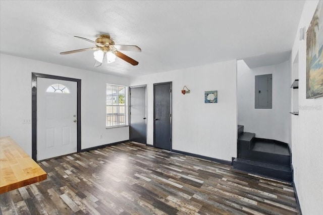 203 1st Ave SE, Steinhatchee, FL 32359 - entrance foyer with electric panel, wood finished floors, a ceiling fan, baseboards, and stairs