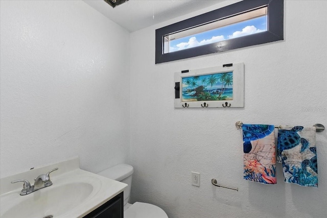 203 1st Ave SE, Steinhatchee, FL 32359 - half bathroom featuring vanity and toilet