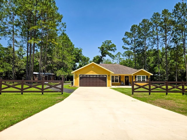 609 NE 2nd St, Williston, FL 32696 - view of front of home with an attached garage and driveway