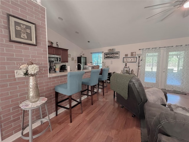 609 NE 2nd St, Williston, FL 32696 - living room with lofted ceiling, light wood-type flooring, and ceiling fan