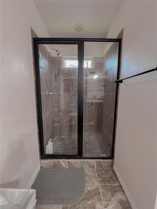 609 NE 2nd St, Williston, FL 32696 - full bathroom with baseboards and a shower stall