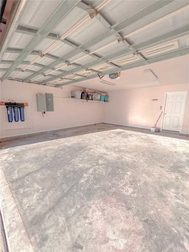 609 NE 2nd St, Williston, FL 32696 - garage featuring a garage door opener and electric panel
