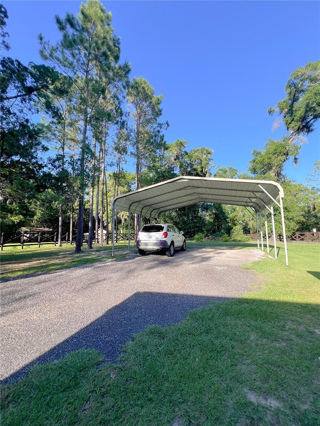 609 NE 2nd St, Williston, FL 32696 - view of car parking featuring a carport and driveway