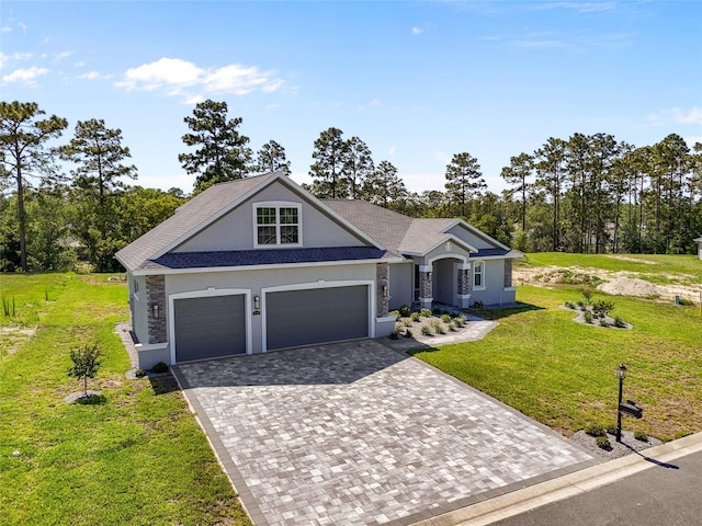 17781 SW 72nd Street Rd, Dunnellon, FL 34432 - view of front of property with stucco siding, decorative driveway, a front lawn, stone siding, and a garage