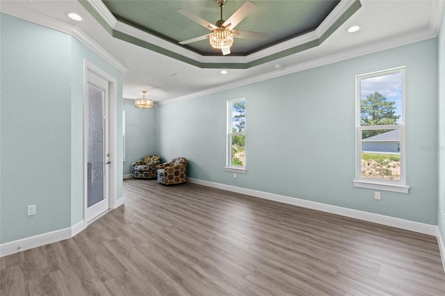 17781 SW 72nd Street Rd, Dunnellon, FL 34432 - empty room with a raised ceiling, crown molding, wood finished floors, recessed lighting, and ceiling fan