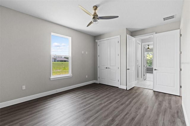 17781 SW 72nd Street Rd, Dunnellon, FL 34432 - unfurnished bedroom with multiple windows, wood finished floors, a closet, and ceiling fan