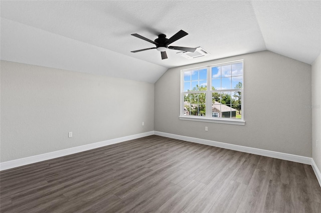 17781 SW 72nd Street Rd, Dunnellon, FL 34432 - bonus room with vaulted ceiling, ceiling fan, dark wood-style flooring, and a textured ceiling
