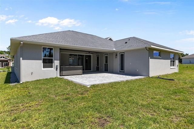 17781 SW 72nd Street Rd, Dunnellon, FL 34432 - back of house with stucco siding, a patio area, a ceiling fan, and a yard