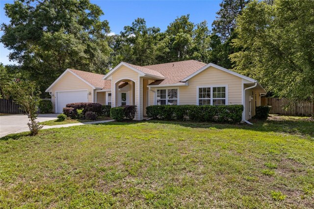 ranch-style home with driveway and a garage