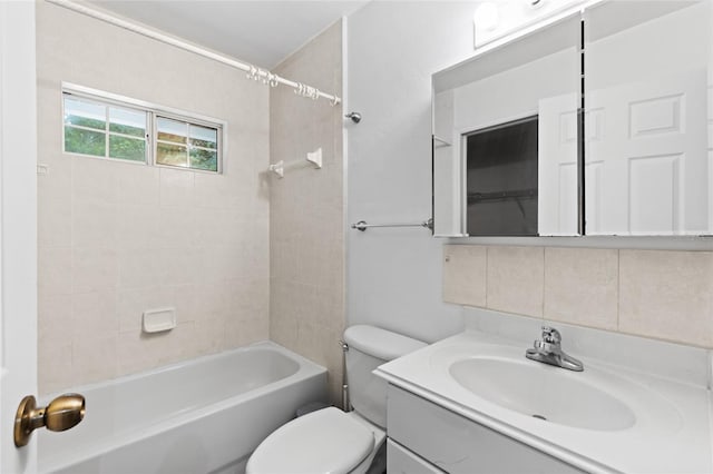 full bathroom featuring backsplash, toilet, vanity, and shower / bathtub combination